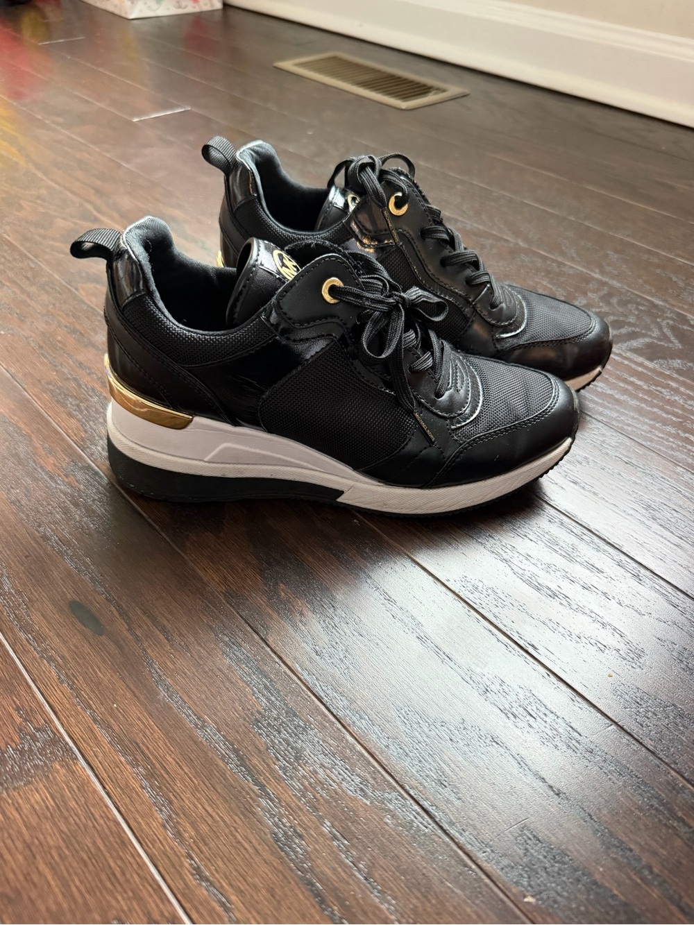 Michael kors Women’s Black Platform Fashion Sneakers with Gold Accent